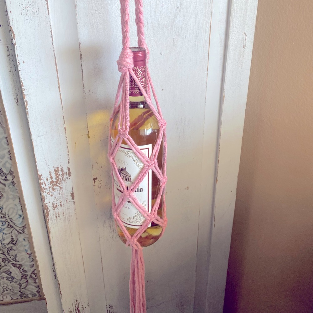 Pink macrame wine holder